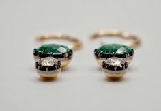 Discover timeless elegance with our hoop earrings featuring two 2-carat oval-cut lab-grown emeralds and two 0.5-carat round-cut moissanites. Set in a classic Georgian/Victorian collet setting, these earrings hang delicately from gold hoops. Embrace effortless sophistication with this beautiful blend of style and grace.Item Details• Made to Order.• Gold Kt: 14K or 18K Solid Gold• Custom Gold Color: Rose Gold, Yellow Gold, White Gold• Cut: Oval and Round• Setting Type: Georgian• Ready to Ship in 20-30 business daysIf you are interested in a custom jewelry piece, feel free to reach out and I’d be happy to work with you on them. If you have any additional questions about these earrings, just hit the "Ask a Question" button (just to the right of the price) and we will get back to you within a f Brooch Jewelry, Round Moissanite, Gold Hoops, 2 Carat, Gold Hoop, Gold Hoop Earrings, Ring Bracelet, Custom Jewelry, Ring Earrings