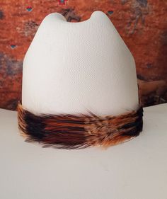 Real, Genuine Feather Hat Band with leather ties make this hatband a great fit for most hats.  - This stunning hat band is made from genuine feathers available in Black and Rusty Brown feathers - Hat bands are shown on a size 7 hat.  Hats are not included. - See my horse hair KEEPSAKES to have a hat band made from your horse's hair:  https://www.etsy.com/shop/BlueEyesDesignsHB?ref=seller-platform-mcnav§ion_id=43697745 - See my HORSE HAIR hat bands:  https://www.etsy.com/shop/BlueEyesDesignsHB?ref=shop-header-name&listing_id=1296906619&from_page=listing§ion_id=50325232 - See my LEATHER hat bands:  https://www.etsy.com/shop/BlueEyesDesignsHB?ref=shop-header-name&listing_id=1296906619&from_page=listing§ion_id=50325502 - See my HAIRPIPE/BEAD hat bands:  https://www.etsy.com/shop/BlueEyesDesign Adjustable Brimmed Top Hat With Feathers, Adjustable Feather Trim Hat Band For Festival, Adjustable Brown Hat With Feather Trim, Adjustable Feather Hat Bands For Festivals, Adjustable Hat Bands With Feather Trim For Festivals, Adjustable Hat Bands With Feathers For Festivals, Adjustable Festival Hat Band With Feather Trim, Brown Mini Hat For Festivals, Adjustable Feather Headband