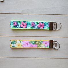 two lanyards with flowers and leaves on them