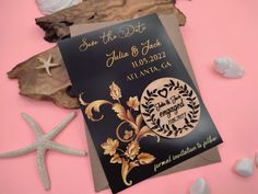 save the date card and starfish on pink background with seashells around it