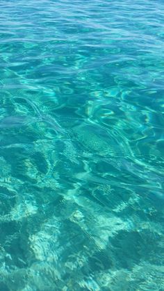 the water is very clear and blue with little ripples on it's surface