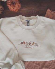 Cute fall embroidered sweatshirt!  Sweatshirt can be tan or green!  Perfect for the fall season!!  Unisex sizing. True to size. Winter Embroidery Sweatshirt, Embroidered Beige Sweater For Fall, Beige Crew Neck Sweatshirt For Fall, Cream Crew Neck Sweatshirt For Fall, Cream Crew Top For Fall, Embroidered Crew Neck Sweater For Fall, Cream Cotton Sweatshirt For Fall, Fall Crew Sweatshirt With Custom Embroidery, Brown Crew Neck Sweatshirt For Fall