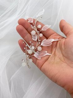 Bridal hair piece with acrylic leaves for a wedding hairstyle. White acrylic leaves with a transparent middle on the thinnest branches of the bridal hair vine for a wedding hairstyle. Silver rhinestones add extra elegance to the hair accessory. White glass beads complete the beauty of the hair accessory.The bridal vine for a wedding hairstyle harmonizes with any white dress. The hair vine is most successfully combined with dresses containing elements of similar colors. It will adorn both blonde Acrylic Leaves, Flowy Hair, Leaf Hair Piece, Pearl Hair Piece, Frosted Hair, Beautiful Tiaras, Flower Gift Ideas, Bridal Hair Piece, Bridal Hair Vine