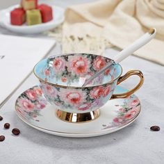 a tea cup and saucer on a table