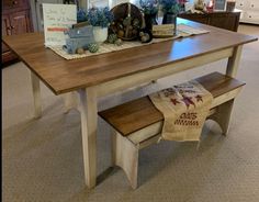 a wooden table and bench in a room