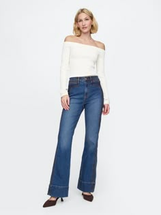 Fit: Snug & flattering through the hip & thigh with a flared leg. ​ Fabric: 86% Cotton, 13% Recycled Materials, 1% Stretch.  Stretch: Stretch Jeans.  A bit of hug & a lot of hold.  Comfortable & designed to flatter.  Rise: High Rise Jeans.  Look: A four-pocket jean in a medium indigo wash.  Details: Zip fly, allover western detailing, front & back pockets.  Responsibly Made: This pair of jeans is part of our water-saving Washwell program.  Compared with conventional wash methods, Washwell uses at least 20% less water and has saved over a billion liters of water since 2016.  Our High Rise Jean has an 11" 28 cm) rise. ​ Slim through the hip & thigh.  Flared leg.  Full-length jeans.  Hits below the ankle. ​ 21. 5" 55 cm) leg opening.  Inseam: Petite 30"76 cm), Short 31"78 cm), Regular 32"81 c 70s Flare Jeans, Low Buy, Rich Girl Fashion, 70s Jeans, The Flare, Jeans Look, Deep Autumn, Brand Collaboration, Support People