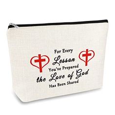 a white zippered bag with red crosses and hearts on the inside that says for every person you've prepared the love of god has been shared