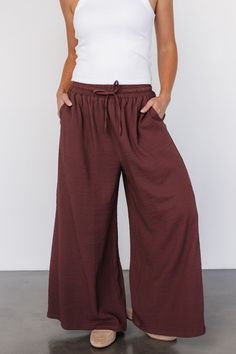 Baltic Born exclusive style The perfect wide-leg pants for traveling, work, or everyday style Puckered gauze-like material Muted warm Brown color Elastic waist with functional drawstring Slash pockets at hip Extra wide leg Marianne is 5'6, cup size 34D, size 6 and wearing size S Brown Ankle-length Wide Leg Pants With Pockets, Brown Wide Leg Ankle-length Pants With Pockets, Brown Wide Leg Pants With Drawstring, Brown Wide-leg Loungewear Pants, Brown Wide Leg Pants With Elastic Waistband For Fall, Brown Ankle-length Wide Leg Pants For Loungewear, Brown Wide Leg Ankle-length Pants For Loungewear, Brown High-waisted Wide Leg Lounge Pants, Brown Wide Leg Pants With Elastic Waistband