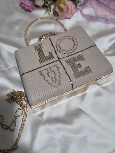 Dimensions: length 20cm/8" height 14cm/6" width 4cm/2" countryside wedding,thank you gift,holiday gift Design Love Women's Bag, Shiny Embroidered Bag, Beige Suede Women's Bag. Bag with Detachable Chain, Handmade Bag with Sparkling Handle. Offering a harmonious blend of elegance and charm, our Design Love women's bag is a testament to excellent craftsmanship. A soft beige suede upper embellished with shimmering embroidery exudes timeless elegance. Its removable chain offers versatility, allowing Silver Bag, Sacs Design, Letter Bag, Design Bag, Silver Bags, Suede Tote, Embroidery Bags, Countryside Wedding, Gift Design