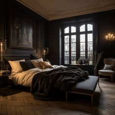 a large bed sitting in the middle of a bedroom next to a window with lots of windows