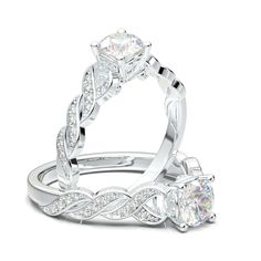 two wedding rings with diamonds on top and side stones in the middle, set against each other