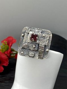 Artisan Art Deco style gemstone ringHand-made Sterling Silver 925size 9-9 1/2Stones used: GarnetFace of the ring:  Height – 27mm, Width-28mm                                        Band height - 5mmUnique Handcrafted One-of a-kind Design RingEach Piece of Jewelry in my Collection is Absolutely One of a Kind!When you start wearing a piece of my jewelry you will fall in love with it more and more each day and feel that good Energy and Love that I pass into it while creating this piece of Art.A piec Tourmaline Bracelet, Artisan Earrings, Garnet Ring, Opal Bracelet, Sterling Silver Flowers, Unique Gemstones, Opal Earrings, Garnet Rings, Good Energy