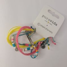 Nwt Pura Vida Charli D'amelio Bracelet Style Holiday Pack - Adjustable Bands, Assorted Designs - Set Of 4 Founded In Costa Rica - Thoughtfully Designed, Each Pura Vida Accessory Is Crafted By Expert Artisans In Costa Rica, El Salvador, India, And More. Our Goal Is To Provide Sustainable Jobs To Artisans Worldwide And Give Back To Causes You Care About. 4 Bright Bracelets To Brighten Your Mood - Update Your Everyday Look By Wearing This Bracelet Stack That Exudes Fun And Playful Vibes! It Include Holiday Pack, Silver Bar Bracelet, Teal Bracelet, White Beads Bracelet, Cute Gifts For Friends, Bracelet Pack, Holiday Packing, Wave Bracelet, Pura Vida Bracelets