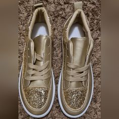 Brand New Never Worn. Majority Of The Shoe Is Gold With White Bottoms. Material Soft Leather With Glitter Around Entire Shoe. Available In Several Sizes. Glitter Fashion, White Bottoms, Fashion Sneakers, Womens Shoes Sneakers, Sneakers Fashion, Soft Leather, Gold Color, Shoes Sneakers, Glitter