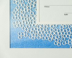 a close up of a paper with circles on it and a place for the name