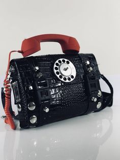 Christmas gift！ Women's leather shoulder bag, with telephone as the handle, unusual, edgy, Goth, Steampunk style. Bag is 2.8mm genuine leather. True piece of art and conversation starter Bag material genuine leather Width 29.50 cm or11 4/8 inches Height without the telephone 21 cm or 8 2/8 inches Retro Leather Shoulder Bag For Party, Punk Style Leather Crossbody Shoulder Bag, Punk Leather Crossbody Shoulder Bag, Vintage Black Satchel With Mobile Phone Bag, Unique Handbags, Statement Bag, Leather Shoulder Handbags, Artist Style, Christmas Gifts For Women