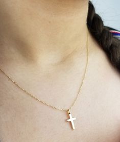 14K SOLID YELLOW GOLD SMALL CROSS NECKLACE Here is a dainty, delicate and simple, yet classy minimalist Cross Necklace. This is 14k Solid Gold. (We do not sell filled or plated jewelry) Perfect for everyday use. Metal : 14K Solid Gold Necklace Length : 17 inches / 42.5cm Cross Height : 16mm Cross Width : 8mm ---Absolutely stunning. Comes in a gift box. ---Shipping Policy---- Item will be shipped within 1-3 business days of receiving full payment. ---Return Policy--- -You may return the unused it 14k Gold Crucifix Necklace For Baptism, White 14k Gold Cross Necklace Gift, White 14k Gold Cross Necklace As Gift, 14k Gold White Cross Necklace As Gift, Gold Cross Pendant Necklace For First Communion, Dainty Cross Pendant Jewelry For First Communion, Minimalist Cross Jewelry For First Communion, 14k Gold Jewelry For First Communion, Gold Cross Pendant Jewelry For Baptism