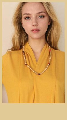 Woman wearing a yellow top and a beaded necklace. Palo Santo Wood, Lotus Earrings, Vibrant Energy, Meaningful Jewelry, Natural Scents, The Natural, Wood Beads, Peru, Seeds