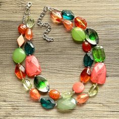 💞One of a kind & ready to ship💞  A color block collision of all my favorite green and coral beads! 16" long with a 4" extender chain. Silver accents and chain.   Thank you for supporting American small business!  *Smoke and pet free home* Hate waiting? Me too! I ship 6 days a week. This is READY TO SHIP!  Thank you for browsing my store! Green Beaded Necklace With Faceted Beads, Green Multi-strand Necklace With Colorful Beads, Green Multi-strand Beaded Necklace, Bold Handmade Green Jewelry, Green Double Strand Necklace With Colorful Beads, Green Double Strand Necklace With Faceted Beads, Chunky Statement Necklace, Chain Silver, Coral Beads