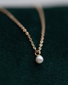 This Mini Pearl Pendant Necklace is the perfect complement for your evening wear or casual wardrobe. Crafted from 14k gold, this delicate necklace features a small cultured pearl, lending it a minimalist and elegant look. With this classic and versatile accessory, you're sure to make a statement. Pearl size: 2.75-3mm 1 Dainty Pearl Chain Necklace For Formal Occasions, Classic 14k Gold Pearl Necklace, Classic Pearl Necklaces With Delicate Chain, Elegant Everyday Necklace With Pearl Charm, Classic Pearl Necklace With Delicate Chain, Classic Pearl Necklace With Delicate Chain For Formal Occasions, Classic Round Pearl Necklace With Delicate Chain, Classic Everyday Necklace With Pearl Charm, Elegant 14k Gold Pearl Necklace With Round Pendant