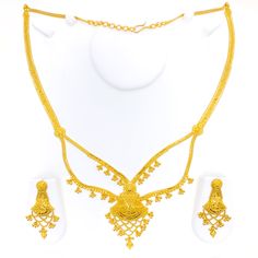 This 22k gold light patta set features a traditional festive tasseled design, perfect for adding elegance to any outfit. Weighing 55.0 grams, it showcases a yellow gold finish that enhances its intricate and celebratory appearance. The set has a length of 24 inches with a 2.5-inch drop and includes adjustable 1.5-inch links for a comfortable fit. Secured with a hook lock, it combines style and practicality. The matching earrings, each 2.2 inches long, feature screw back posts for added security. Festive Bollywood Jewelry Sets In Yellow Gold, Festive Yellow Gold Jewelry Sets With Latkans, Festive Bollywood Yellow Gold Jewelry Sets, Yellow Gold Jewelry Sets With Latkans For Festive Occasions, Traditional Yellow Gold Jewelry Set For Diwali, Festive Gold Sets With Intricate Design, Gold Temple Jewelry Set For Formal Occasions, Gold Sets For Formal Diwali Occasion, Gold Formal Sets For Diwali