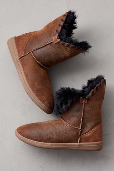 Give your winter look a playful, pretty pop with the Wren sheepskin boot, crafted to keep you comfy and warm wherever the day takes you. Made from insulating double-faced shearling sheepskin, these easy-on boots can be styled two ways: worn up to showcase a distinctive whipstitch detail along raw-edge cuffs, or folded down to reveal their plush interior—the magically soft component that keeps your feet cozy from cuff to toe. Thermo rubber insoles and Goodyear welt construction provide sturdy sup Cozy Leather Boots For Fall, Brown Sheepskin Boots With Faux Fur Lining, Waterproof Suede Boots, Suede Cowboy Boots, Ankle Cowboy Boots, Stylish Footwear, Sheepskin Slippers, Suede Leather Shoes, Slippers For Women