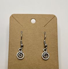 Cute swirl earrings; earring hooks are sterling silver and hypoallergenic; includes rubber backing. Spiral Earrings With Ear Wire For Gifts, Spiral Earrings With Ear Wire As Gift, Nickel Free Silver Swirl Earrings, Sterling Silver Swirl Earrings For Gift, Swirl Shaped Sterling Silver Earrings For Gifts, Swirl-shaped Earrings With Ear Wire, Silver Adjustable Hypoallergenic Wrap Earrings, Hypoallergenic Sterling Silver Swirl Earrings, Hypoallergenic Spiral Metal Earrings