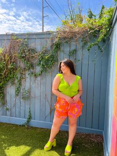 Can we talk about this COLOR for a moment? Something about a vibrant lime green has us dreaming of summer days. With so many things to love about this top, it is hard to narrow it down. It features a fun flutter strap, flattering tie in the chest, full-length fit, and ruching on the sides. We paired it with the Tangerine Dream floral shorts for a full-on colorful moment. A color as BOLD as you are Full length fit so it pairs perfectly with everything Flattering design details It will get you in Spring Swimwear With Tie Straps, Playful Green Tops For Summer, Fun Green Swimwear For Summer, Green Fun Tops For Day Out, Playful Green Summer Tops, Fun Green Tops For Day Out, Trendy Neon Yellow Swimwear For Spring, Green Swimwear For Spring Day Out, Green Tropical Swimwear For Day Out