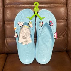 Brand New Crocs Classic Women's Hello Kitty Flip Flop Sandals Size: 9 Color: Light Blue Crocs Flip Flops Woman, Cute Blue Sandals For Vacation, Cute Blue Round Toe Sandals, Cute Non-slip Flat Flip Flops, Cute Non-slip Blue Sandals, Light Blue Synthetic Flat Flip Flops, Cute Blue Flip Flops For Vacation, Playful Blue Adjustable Sandals, Playful Adjustable Blue Sandals