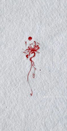 a piece of white paper with red ink on it and a rose drawn in the middle