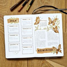 an open planner sitting on top of a wooden table