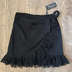 Nwt! From Boutique Isabelles Cabinet Eyelet Ruffle Wrap Mini Skirt. Black Lace Trim Mini Skirt For Summer, Black Lace Mini Skirt For Spring, Lace Ruffled Skirt For The Beach, Black Lace Mini Skirt For Summer, Lace Ruffled Beach Skirt, Lace Ruffled Skirt For Beach, Spring Black Skirt With Lace Trim, Black Skirt With Lace Trim For Spring, Black Lace Trim Skirt For Spring