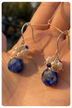 Crafted with celestial elegance, our lapis lazuli and pearl eardrops exude a sense of serenity and grace. #lapisearring#dropearring#wirewrap#silverearring#beachstyle#boohojewelry Handmade Elegant Long Drop Chandelier Earrings, Handmade Elegant Teardrop Earrings, Handmade Elegant Adjustable Chandelier Earrings, Handmade Adjustable Elegant Chandelier Earrings, Elegant Wire Wrapped Hoop Earrings Gift, Elegant Adjustable Nickel-free Teardrop Earrings, Elegant Round Wire Wrapped Jewelry, Elegant Silver Teardrop Wrap Earrings, Wire Wrapped Sterling Silver Chandelier Earrings