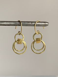 "22k Gold, 18k Gold Hoop Earrings, Hammered Earrings, Gold Hoop Earrings, Fine Jewelry, Dangle Earrings, Hammered Gold Earrings, Artisan Earrings, Solid Gold Earrings, Chandelier Earrings, Unique Earrings Elegantly worn but look great worn casually with jeans, these solid Gold Artisan earrings are unique in design as they are handmade and hammered individually. The 18k Gold upper and lower hoops are joined by 22K Gold hammered straps making them an unusual multi-hoop pair of earrings. They are l 22k Gold Earrings, Minimalistic Jewelry, Organic Earrings, Simple Gold Earrings, Bubble House, Earrings Gold Hoop, Earrings Chandelier, Hammered Earrings, 18k Gold Earrings