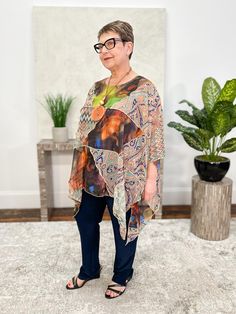 Sterling Style's georgette tops add an artful touch to any look. In a funky mix of prints, this style features an oversized patchwork body with overstitch detailing. A curved hemline points at the sides with vent detail, and it's finished with a round neckline and short dolman sleeves. Fit fact: A generous one-size-fits-most; we recommend for sizes up to 3X Lisa (size 12/14, 5'1") models. Georgette and mixed wovens 100% Artsilk Dry Clean Only Made in India Style # 5432CUTOP India Style, Georgette Tops, India Fashion, Dolman Sleeve, Round Neckline, Cover Up, Size 12, Dry Clean, Models