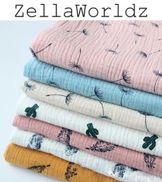 four different colored blankets stacked on top of each other with the words zellaworlddz written above them