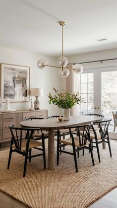 the dining room table is surrounded by chairs