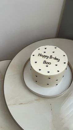 a birthday cake sitting on top of a white plate