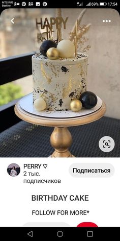 a birthday cake with gold and black decorations