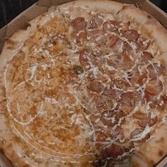 a pizza sitting in a box on top of a table