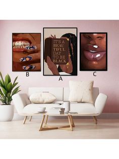 three posters on the wall above a white couch in a living room with pink walls