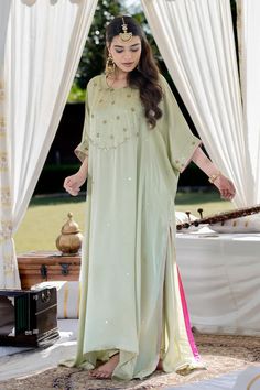 Pista green asymmetric kaftan with sequin and aari embroidery. Paired with a pant. - Aza Fashions Green Kaftan For Wedding And Festivals, Green Dabka Dresses For Reception, Green Dresses With Dabka For Reception, Green Wedding Kaftan, Elegant Green Kaftan For Festivals, Green Maxi Length Kaftan For Wedding, Elegant Green Festival Kaftan, Green Kaftan For Festivals With Traditional Drape, Reception Kaftan With Resham Embroidery For Festivals