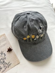 Hand embroidered baseball cap. ★ ABOUT * Cap is %100 cotton and has adjustable bucket. * Floral embroidery is done by hand with cotton thread * All orders are made to order and handmade, therefore embroidery will vary on each unique cap. Every item is unique and one of a kind * Perfect for everyday wear, outdoor activities, etc. * We do custom orders, please contact us for discussion. ★ CARE: * Please refer to here on how to clean baseball cap: https://www.whirlpool.com/blog/washers-and-dryers/h Hand Embroidered Flower, Custom Embroidered Hats, Summer Cap, Flower Hat, Hat Custom, Embroidered Hat, Embroidered Baseball, Embroidered Baseball Caps, Flower Hats