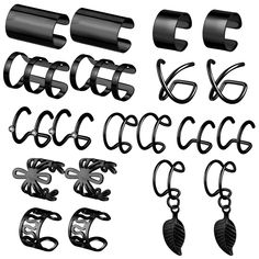 a set of black metal objects on a white background with clippings to cut out the letters and numbers