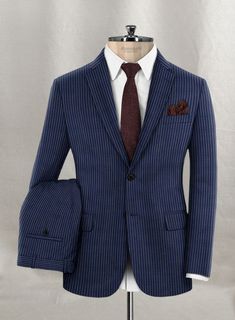 Sprinkle the stylish elegance with our Napolean Koro Wool Suit, which embraces the boldness of sartorial ambitions. Appoint a classy sophistication with our suit, crafted from a wool blend fabric that outlines a smooth, feathery texture with delicate accents and a stripes pattern over a blue tint that highlights vibrant character. Balance an exquisite taste with a sublimely tailored blue suit that captures a sense of luxury while ensuring ideal relaxation to pursue exhilarating occasions and cru Tailored Wool Suits For Semi-formal Occasions, Wool Suit With Suit Collar For Office, Wool Suits With Suit Collar For Office, Wool Suits With Notch Lapel, Fitted Wool Suit For Office, Fitted Wool Suits For Office, Fitted Wool Three-piece Suit For Office, Custom Fit Wool Suits For Office, Elegant Winter Suits For Office Wear