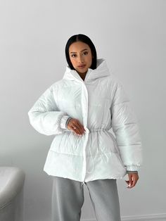 Oversized short puffer jacket for winter, super warm and cozy. Our puffer jacket is a valuable asset to your wardrobe. It will keep you warm due to its synthetic feathers, which is called "air feathers". MEASUREMENTS of THE PUFFER JACKET Jacket length (along the back) 26.7 inches or 68 cm Sleeve length (from the shoulder seam) 22.8 inches or 58 cm shoulder length 6 inches or 15 cm width in the bust area is 24.8 inches or 63 cm SIZES 1 universal size, fits women of S-M sizes M BUST up to 39 inche Winter White Puffer Parka For Cold Weather, Trendy Puffer Hooded Jacket For Cold Weather, Puffer Jacket With Drawstring Hood For Cold Weather, Solid Puffer Jacket With Drawstring Hood For Cold Weather, Oversized Winter White Puffer Jacket, Winter White Hooded Down Puffer Jacket, Hooded Winter White Puffer Jacket For Cold Weather, Trendy Hooded Puffer Parka, Winter White Puffer Jacket With Detachable Hood