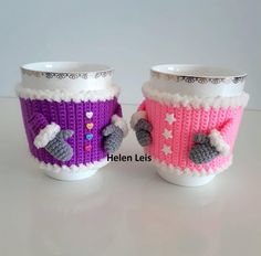 two knitted cups sitting next to each other