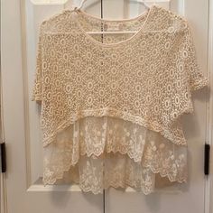 High-Low Crochet Top With Embroidered Ruffles From Altar’d State. Never Worn. Loose And Flowy. Casual Lace Blouse With Lace Work, Beige Crochet Lace For Spring, Spring Beige Crochet Lace, Summer Lace Tops With Crew Neck, Summer Lace Crew Neck Top, Summer Lace Top With Crew Neck, Spring Lace Crochet Top With Lace Work, Cream Open Knit Lace Tops, Cream Lace Top With Open Knit