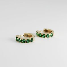 "14k emerald hoop earrings are made of 14k yellow gold. Material; 14k solid gold hoops Earrings measure , inner diameter is 10mm outer diameter is 13.45mm Round Emeralds: 12 pieces (for the pair) Emerald size : 2.5mm Emeralds are lab grown It is a great birthday gift for your special ones whose birthday are in May, since Emerald is May birthstone. This solid gold ring makes a perfect present for your anniversaries. Emerald is especially 20th and 50th anniversary stone. As the stone of the heart, Green 14k Gold Hoop Earrings, Small Hoop Green Earrings For May Birthstone, Elegant Emerald Huggie Hoop Earrings, Green Tarnish-resistant Huggie Jewelry, Hoop Earrings With May Birthstone Gemstone, Green Small Hoop Huggie Earrings For May Birthstone, Hoop Earrings For Anniversary With May Birthstone, May Birthstone Gemstone Hoop Earrings, Green Huggie Earrings With Matching Set