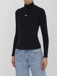 Black long-sleeved high-collar top in matte spandex featuring a printed Activewear logo on the front. Visible topstitching. Tight fit. Size nationality: US Product number: 7774508 Product code: 7970414E2B91081 Composition: 58% polyamide, 42% elastane Athleisure Stretch Turtleneck Tops, Long Sleeve Top With Thumbholes And Minimal Stretch, Sporty Stretch Top With Funnel Neck, Athleisure High Neck Tops With Thumbholes, Functional Stretch High Neck Tops, Sporty High-neck Top With High Stretch, High Stretch Sporty Top With High Neck, Sporty High Neck Top With High Stretch, Sporty High Neck Tops With Thumbholes